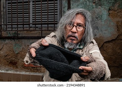 Selective Focus Homeless Poverty Man Meet Financial Crisis Ask For Food, Dirty Aged Man With Beard Sleep On Street Begging For Money, No Job. Society's Economic Problem Abandoned Elderly People Health