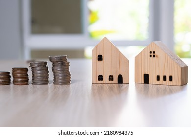 Selective Focus At House Model. For Home Saving, Property With Small Wood House And Calculator On The Background. Wealth And Saving Plan For House Mortgage. Personal Investment Concept.