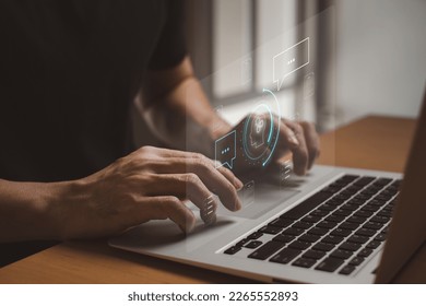 Selective focus at human hand while type or input a command to navigate chatbot or AI to get answer or information from big database. Artificial intelligence that can provide SEO or business info.