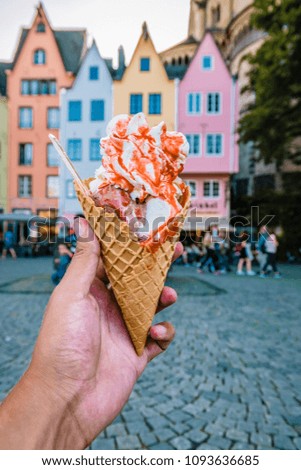 selective focus of an ice cream corn with vanile and strawberry , Cologne Koln Germany