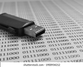 Selective focus image with noise effect of binary code paper and pendrive.Digital electronic concept.