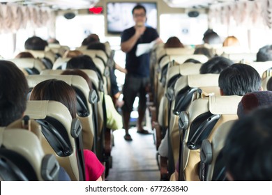 Selective focus image of Private bus with tourists and guided tour. - Shutterstock ID 677263840