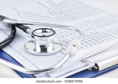 Selective focus image stethoscope over a document serial code. Medical concept - Shutterstock ID 1928475998