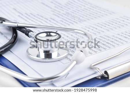 Selective focus image stethoscope over a document serial code. Medical concept