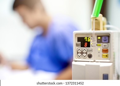 Selective Focus To Infusion Pumps With Blurry Patient Play Smart Phone In Hospital. The Concept Of Working Anytime. - Image