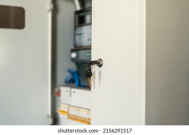 Selective Focus. Inserted Keys Into The Lock Of A Metal Box With An Electricity Meter. Close-up.