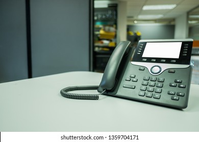 selective focus ip phone device on the desk office with workspace
