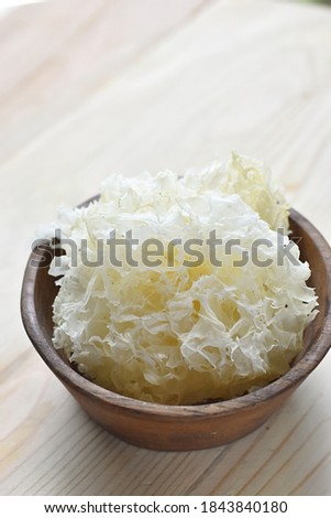 selective focus of jamur es or white fungu on wooden bowl, popular for dessert
