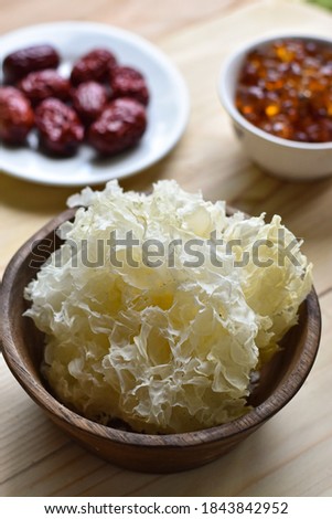 selective focus of jamur es or white fungu on wooden bowl, popular for dessert