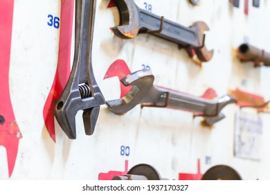 Selective Focus Layout Tools Of Technician On White Wooden Board Background. Silver Tools Of Construction And Engineering For Build And Fixed. 