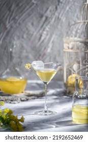 Selective Focus Lemon Lemonade With Ice In Martini Glass With Lemon Zest Garnish