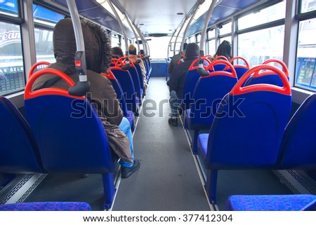 Selective focus of London's double decker bus with people jurney