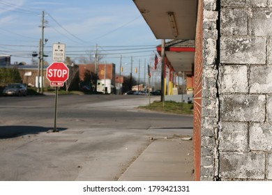 Selective Focus Looking Around The Corner At An Intersection In Small Town USA. Photo Taken In Leeds, Alabama.