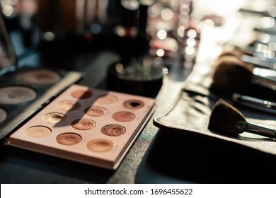 selective focus of makeup brush set near eye shadow
