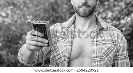 selective focus of man with bourbon hipflask outdoor. man with bourbon hipflask