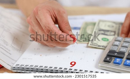 Selective focus with man hand pay date off debts of credit cards as rent and domestic bills. Financial problems concept