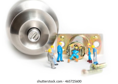 Selective Focus Of Miniature Engineer And Worker Build Stainless Steel Round Ball Door Knob Components On White Background As Locksmith, Business And Industrial Concept.