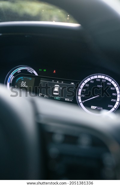 A selective focus of a\
modern car dashboard under the sunlight through the front\
windshield