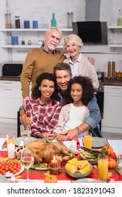 Selective Focus Of Multicultural Family Embracing During Thanksgiving Celebration