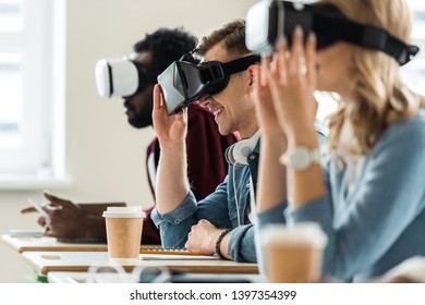 selective focus of multiethnic students using vr headsets in university - Powered by Shutterstock