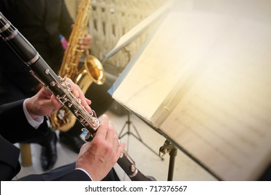 Selective focus of musicians, blurred of clarinet for background.