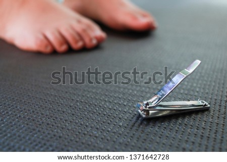 selective Focus Nail cilpper and blur foot.