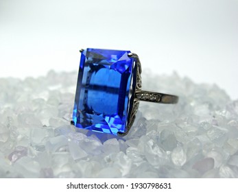 Selective focus lot of natural rough white sapphire gemstone for cutting and blue sapphire ring.