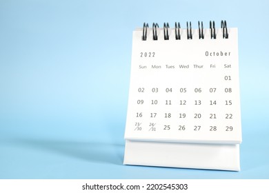 Selective focus of October 2022 desk calendar on green background with copy space. - Shutterstock ID 2202545303