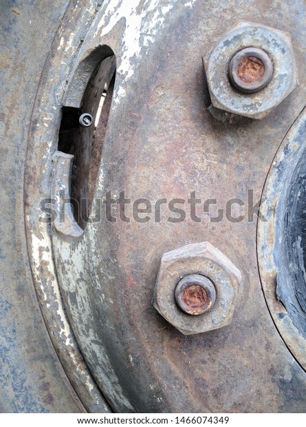 Selective focus of old rusty truck\
wheel, vintage photo. dirty truck wheel. abandoned truck\
wheel