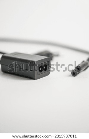 Selective focus on action camera charging box-shaped isolated on white background