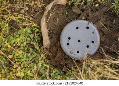Selective focus on biopore infiltration making. The making of Biopore Infiltration Holes to Prevent Flooding and Produce Compost best for the environment. with motion blur on hand. 