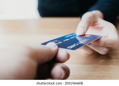 Selective Focus On Blue Credit Card (mock Up) Was Held By Woman's Hand To Buy Or Shopping Product And Service In Retail Convenience Store - Purchase, Commerce, Finance, Business And Consume Concept