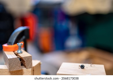 Selective focus on cracked and split wood from not drilling a pilot hole before driving a screw