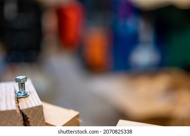 Selective focus on cracked and split wood from not drilling a pilot hole before driving a screw