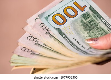 Selective Focus On Detail Of USD Banknotes. Counting Or Giving United States Dollars Banknotes. World Money Concept, Inflation And Economy Concept