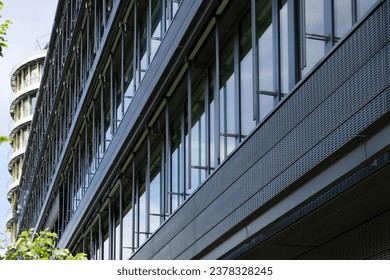 selective focus on the diagonal design of the facade of a modern office made of glass and metal