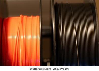 Selective focus on different colored spools of 3d printer filament 