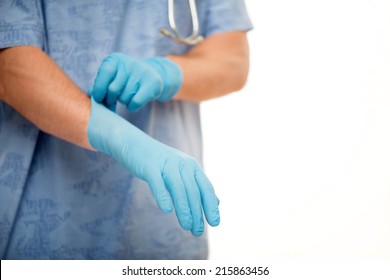 Selective Focus On The Doctor Putting On Blue Disposable Gloves