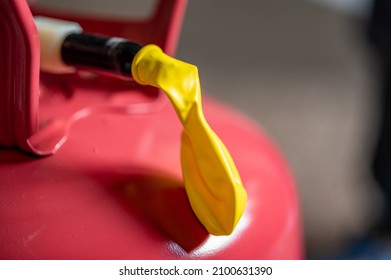 Selective Focus On Edge Of An Inflatable Balloon Attached To A Helium Canister.