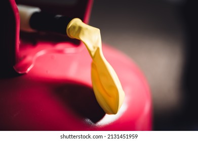 Selective Focus On Edge Of An Inflatable Balloon Attached To A Helium Canister.