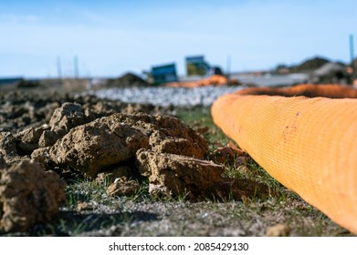 Selective Focus On Filter Sock Around Exposed Dirt At A Construction Site To Prevent Stormwater Erosion And Runoff 