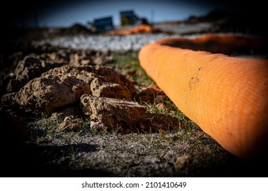 Selective Focus On Filter Sock Around Exposed Dirt At A Construction Site To Prevent Stormwater Erosion And Runoff 