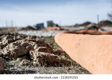 Selective Focus On Filter Sock Around Exposed Dirt At A Construction Site To Prevent Stormwater Erosion And Runoff 