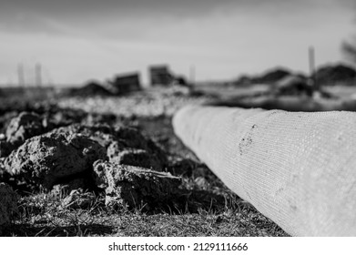 Selective Focus On Filter Sock Around Exposed Dirt At A Construction Site To Prevent Stormwater Erosion And Runoff 