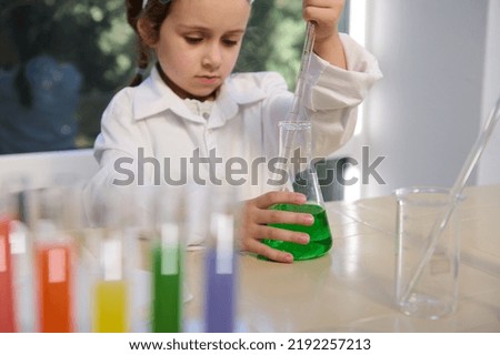 Similar – Image, Stock Photo Happy kid looking liquid through magnifying glass