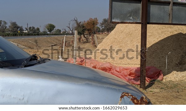 Selective focus on four wheeler bonnet view\
parked in countryside. Technology or transportation concept.\
13\
February 2020 : Reengus, Rajasthan, India. \
