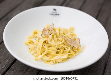 Selective focus on freshly cooked tagliatelle with sliced truffle mushrooms as serves in a restaurant in Tokyo.