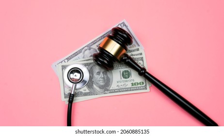Selective focus on gavel and stethoscope. Medical fraud and scam concept. Life insurance fraud