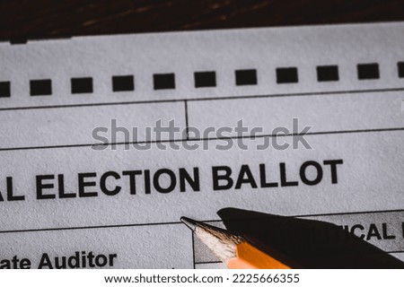 Selective focus on a generic election ballot with a pencil on top.