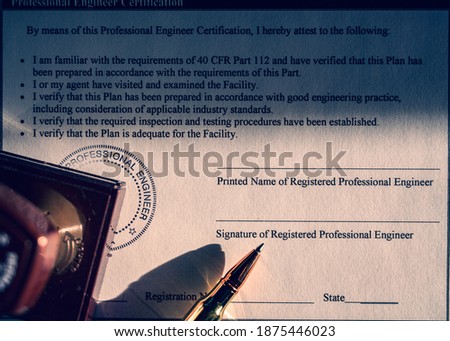 Selective focus on generic professional engineer, architecture. or surveyor stamp and certification statement